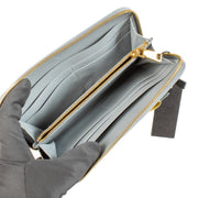 Shop safe online at Labellov in Antwerp, Brussels and Knokke this 100% authentic second hand Prada Blue Leather Bow Zip Around Wallet