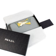 Shop safe online at Labellov in Antwerp, Brussels and Knokke this 100% authentic second hand Prada Blue Leather Bow Zip Around Wallet