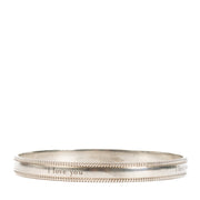 Shop safe online at Labellov in Antwerp, Brussels and Knokke this 100% authentic second hand Tiffany & Co. Silver I Love You Bangle Bracelet - Size 61