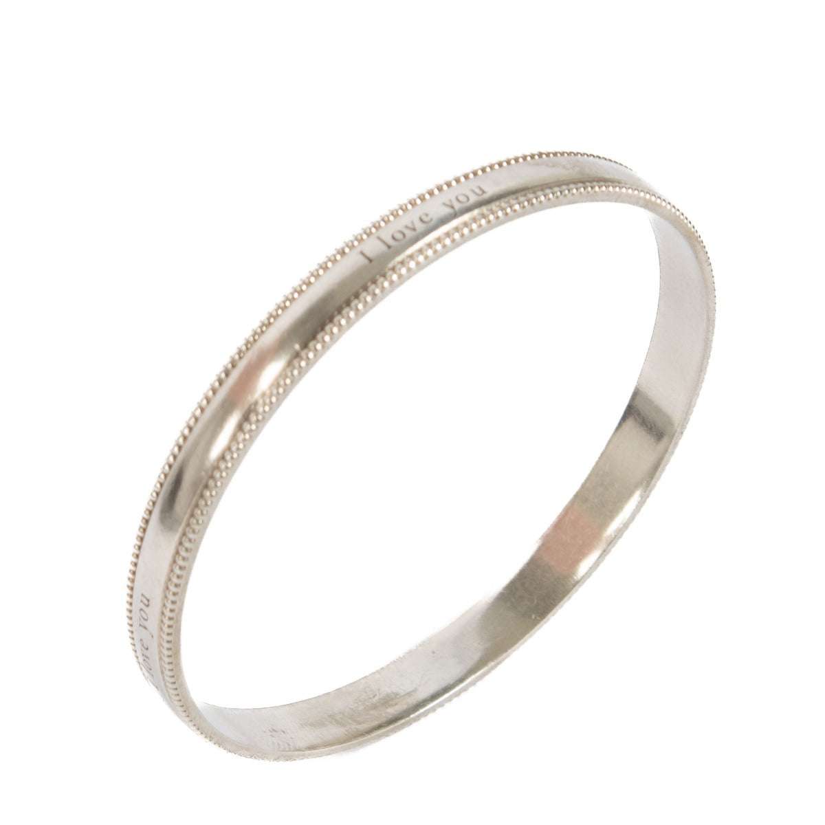 Shop safe online at Labellov in Antwerp, Brussels and Knokke this 100% authentic second hand Tiffany & Co. Silver I Love You Bangle Bracelet - Size 61