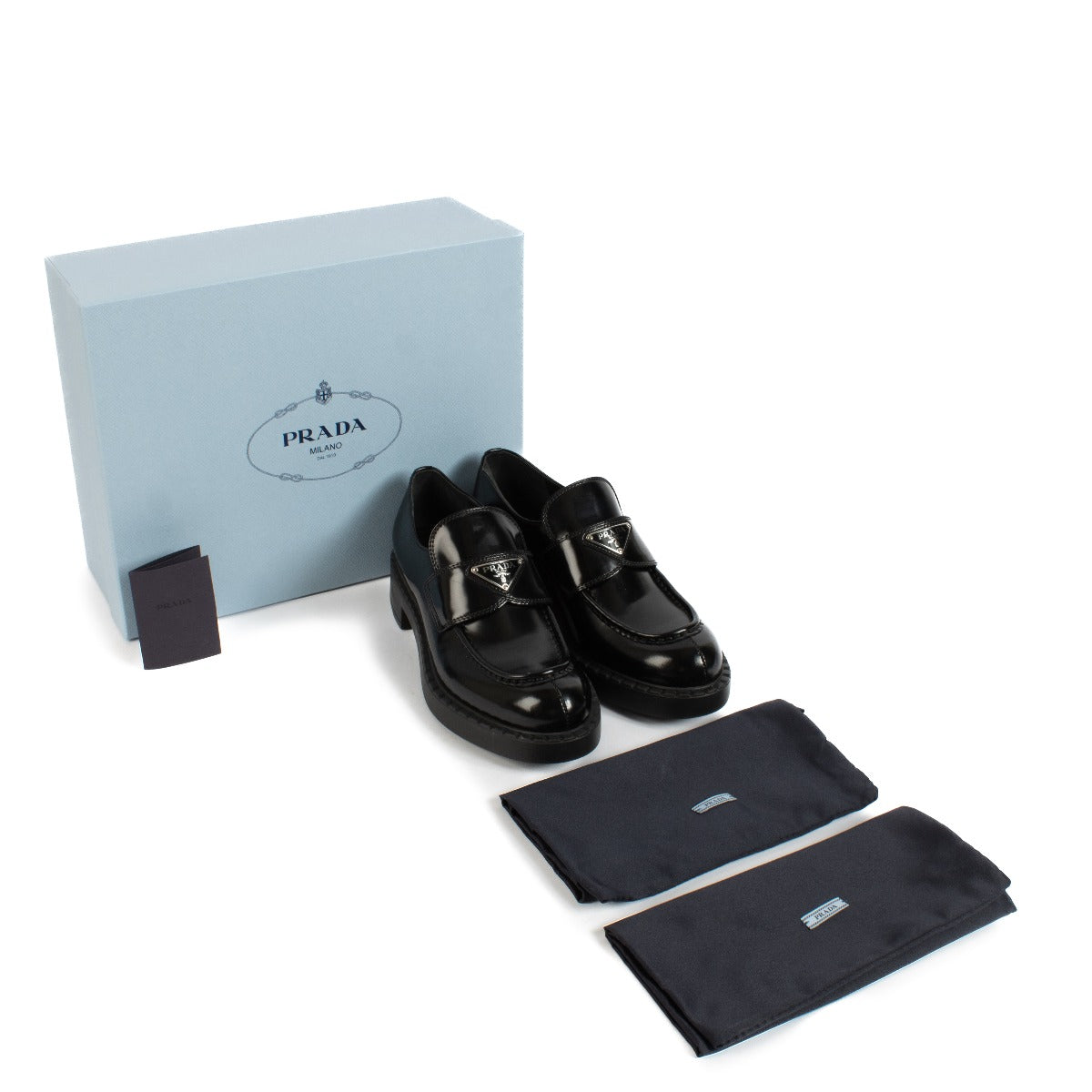 Shop safe online at Labellov in Antwerp, Brussels and Knokke this 100% authentic second hand Prada Black Brushed Leather Chocolate Loafers