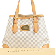 Shop safe online at Labellov in Antwerp, Brussels and Knokke this 100% authentic second hand Louis Vuitton Damier Azur Hampstead MM Bag