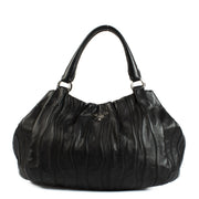 Shop safe online at labellov in Antwerp, Brussels and Knokke this 100% authentic second hand Prada Black Leather Waves Shoulder Bag