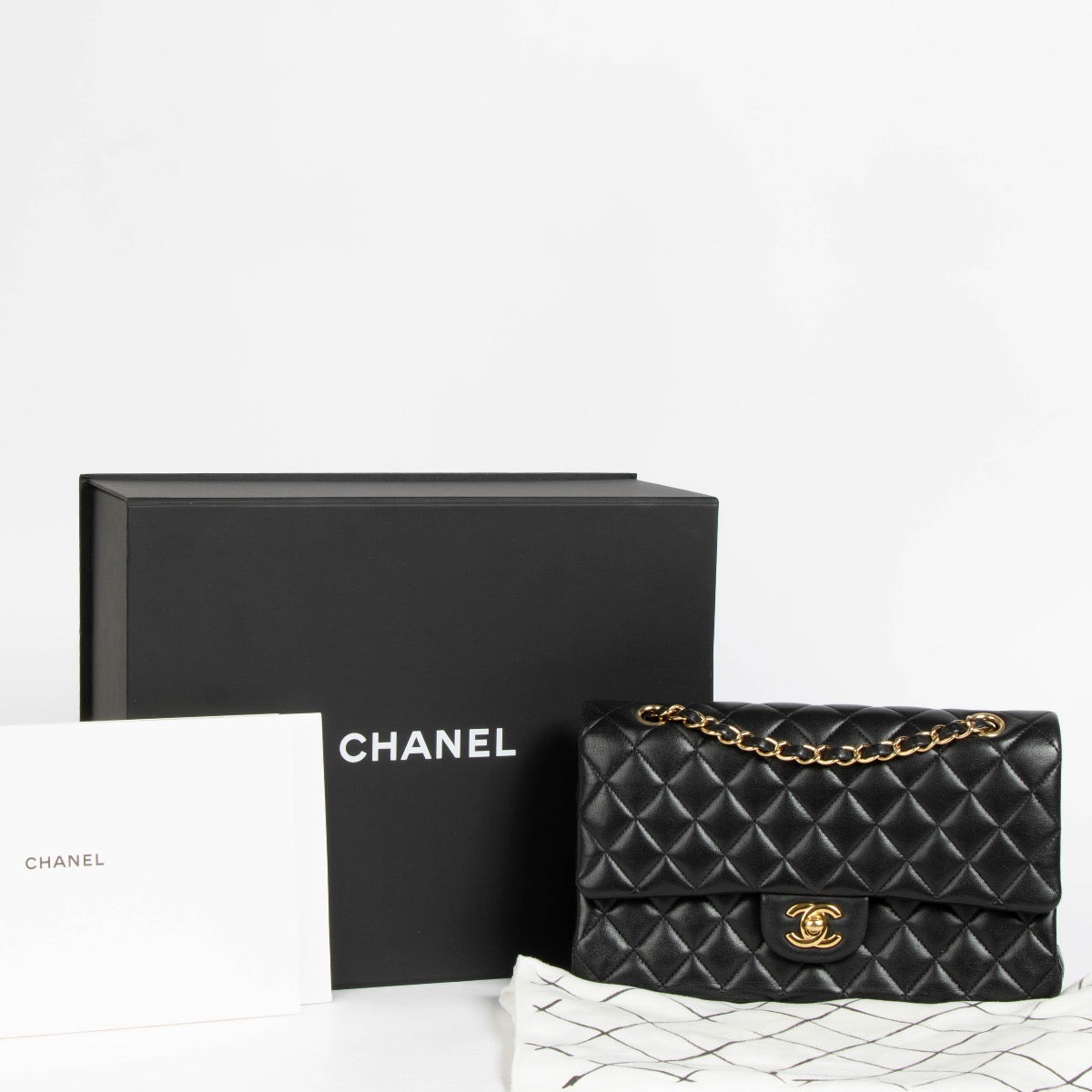 Authentic pre-loved Chanel Black Lambskin Medium Classic 11.12 Handbag on Labellov.com