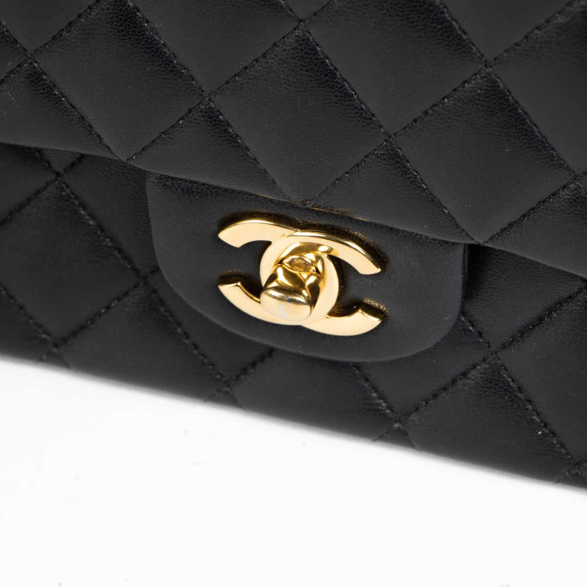 Authentic pre-loved Chanel Black Lambskin Medium Classic 11.12 Handbag on Labellov.com