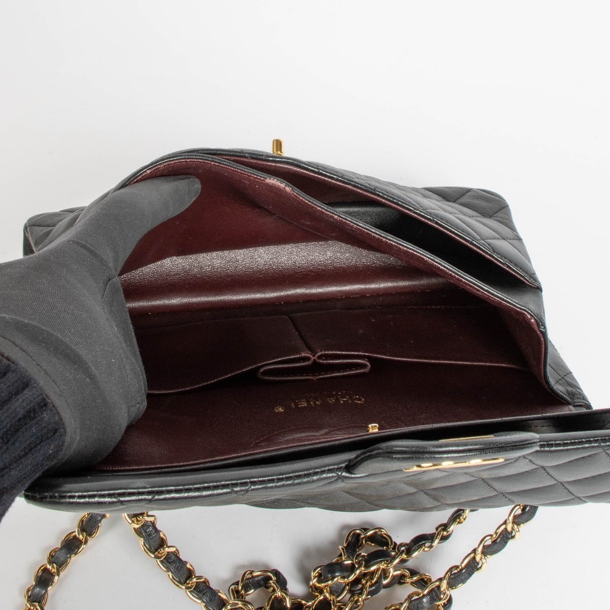 Authentic pre-loved Chanel Black Lambskin Medium Classic 11.12 Handbag on Labellov.com