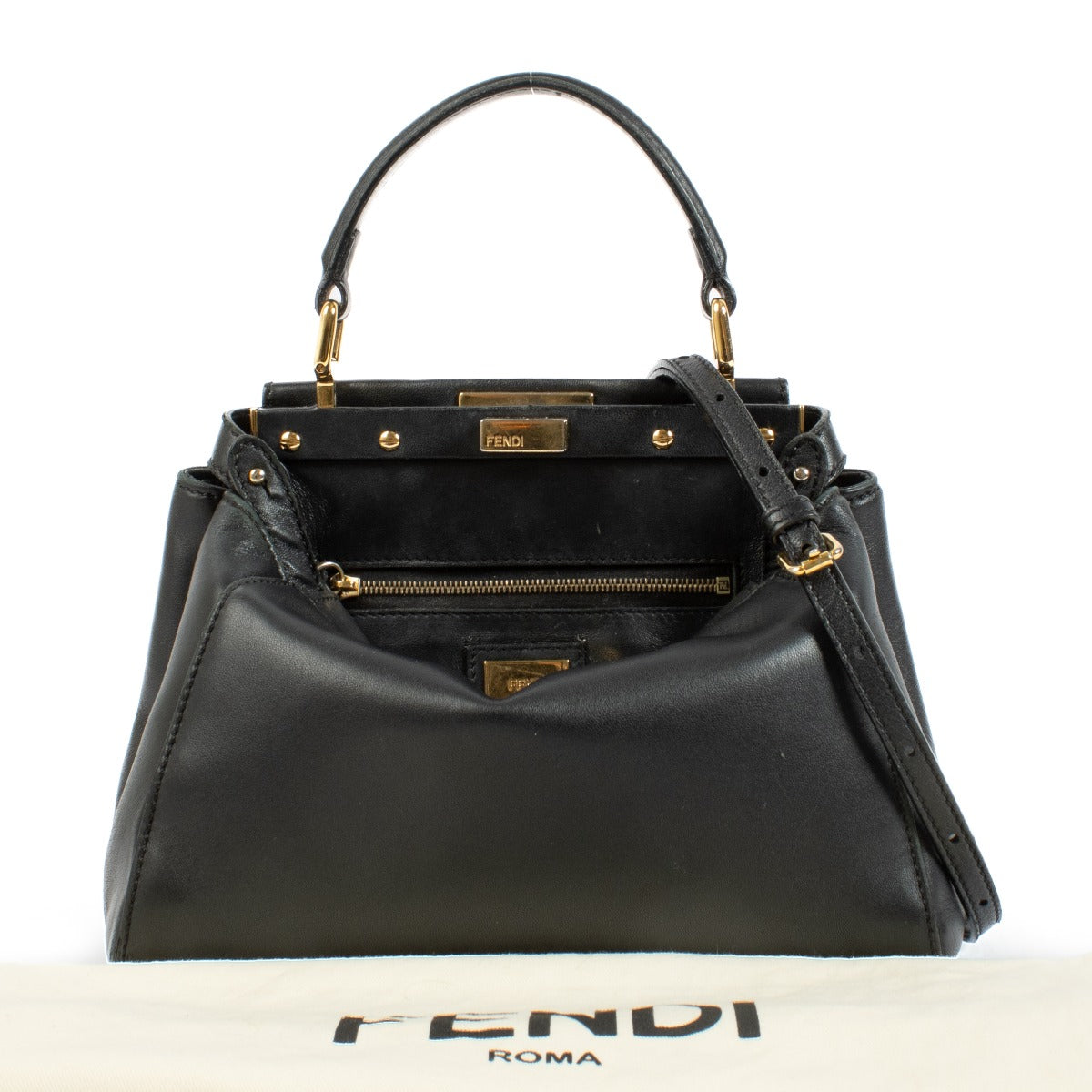 Discover the Fendi Black Mini Peekaboo Bag – a timeless luxury piece crafted from black leather with elegant gold hardware. Featuring a top handle and detachable strap, it's perfect for both everyday wear and evening outings. Shop this iconic designer han