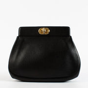 Delvaux vintage black leather clutch with gold turnlock closure at Labellov.com