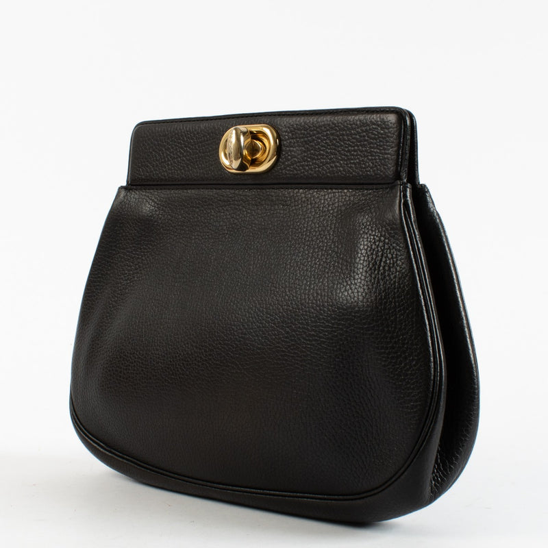 Delvaux vintage black leather clutch with gold turnlock closure at Labellov.com