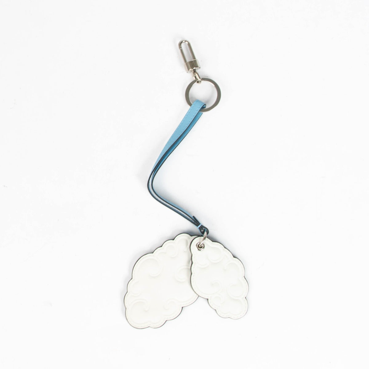 Authentic pre-loved Delvaux Blue 2015 Rene Magritte Cloud Bag Charm on Labellov.com