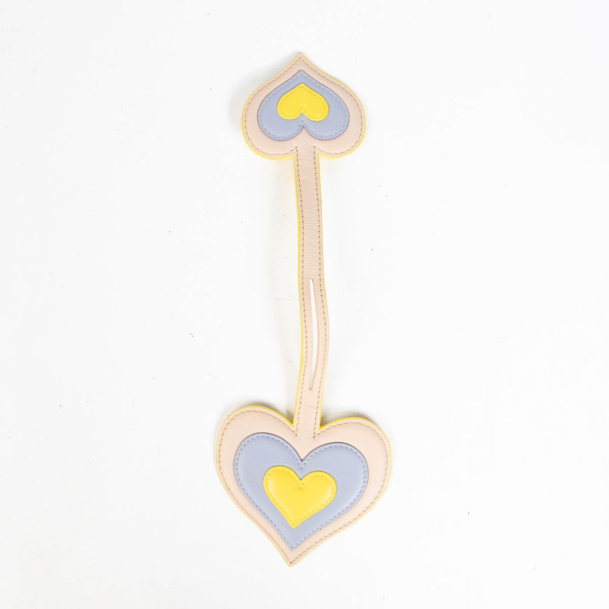 Authentic pre-loved Delvaux Yellow Leather Heart Charm on Labellov.com