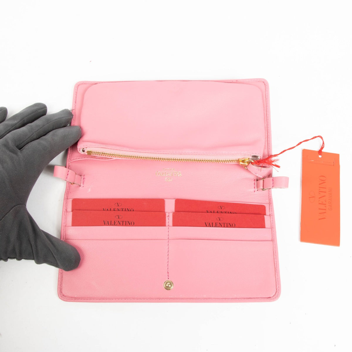 Shop this authentic Valentino Garavani Pink Cluth pre-loved on Labellov.com