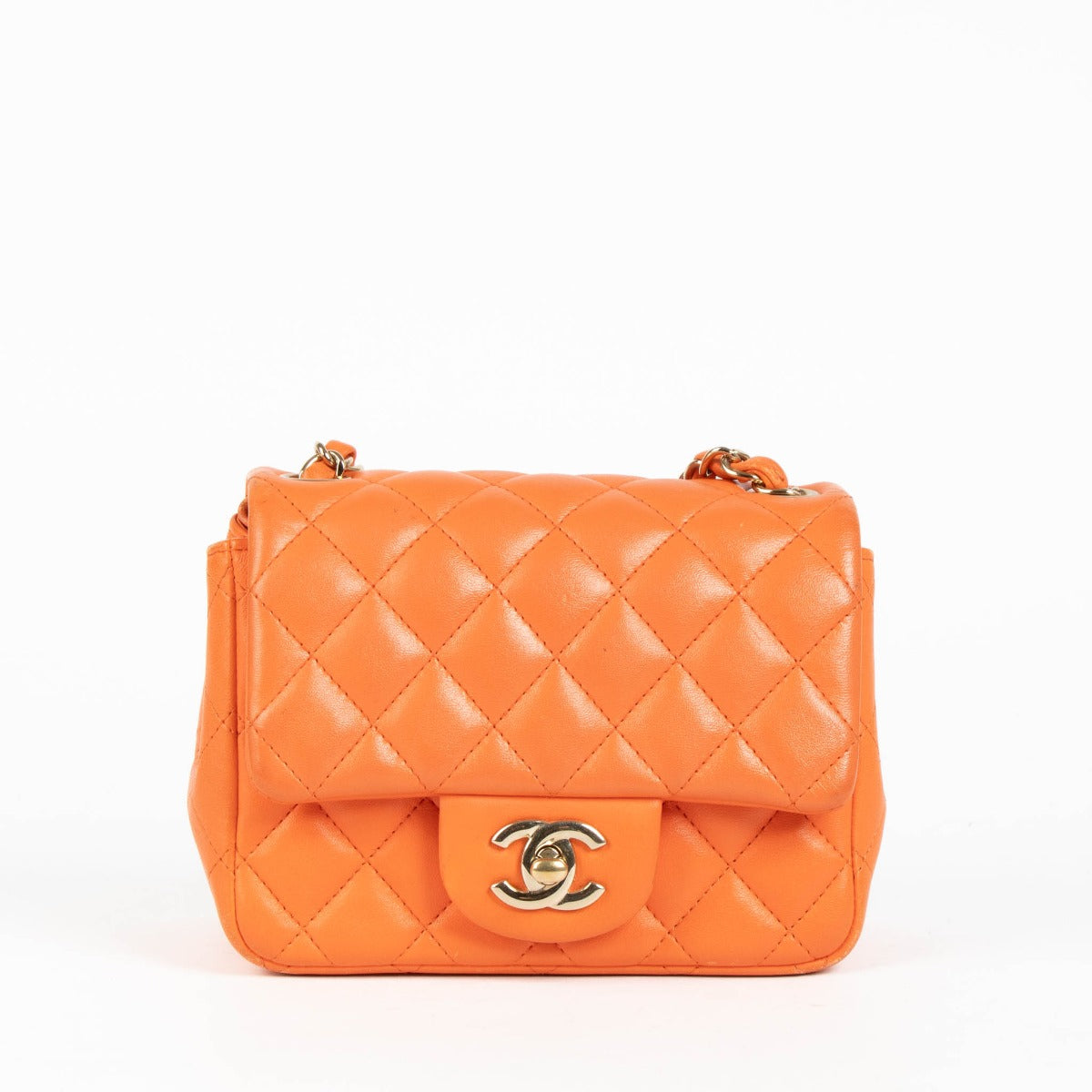 Shop this 100% authentic Chanel Orange Lambskin Mini Square Classic Bag at Labellov.com