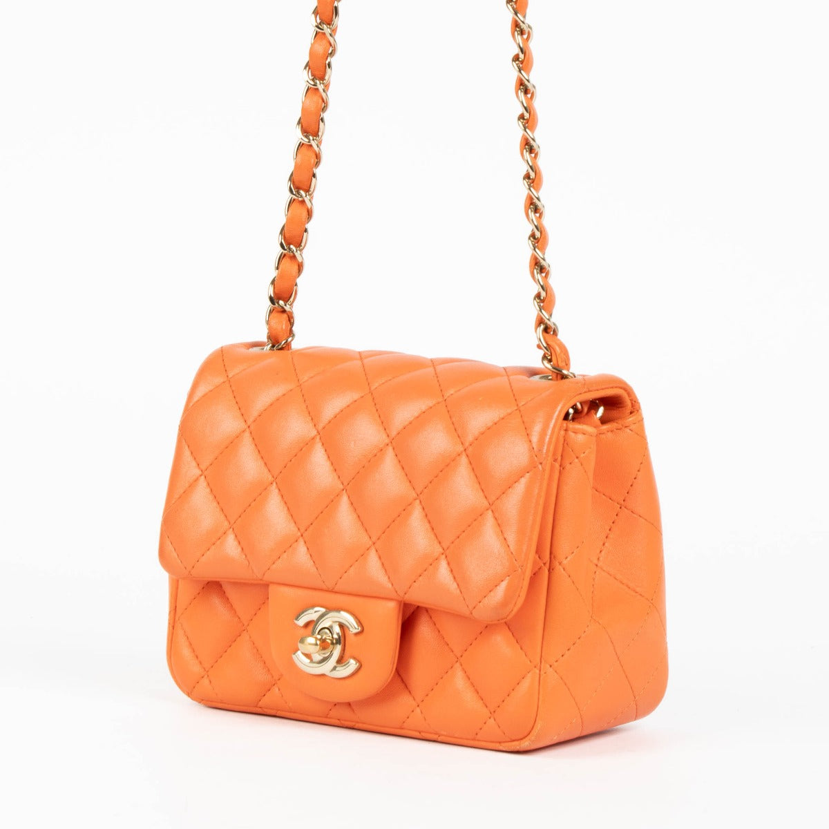 Shop this 100% authentic Chanel Orange Lambskin Mini Square Classic Bag at Labellov.com
