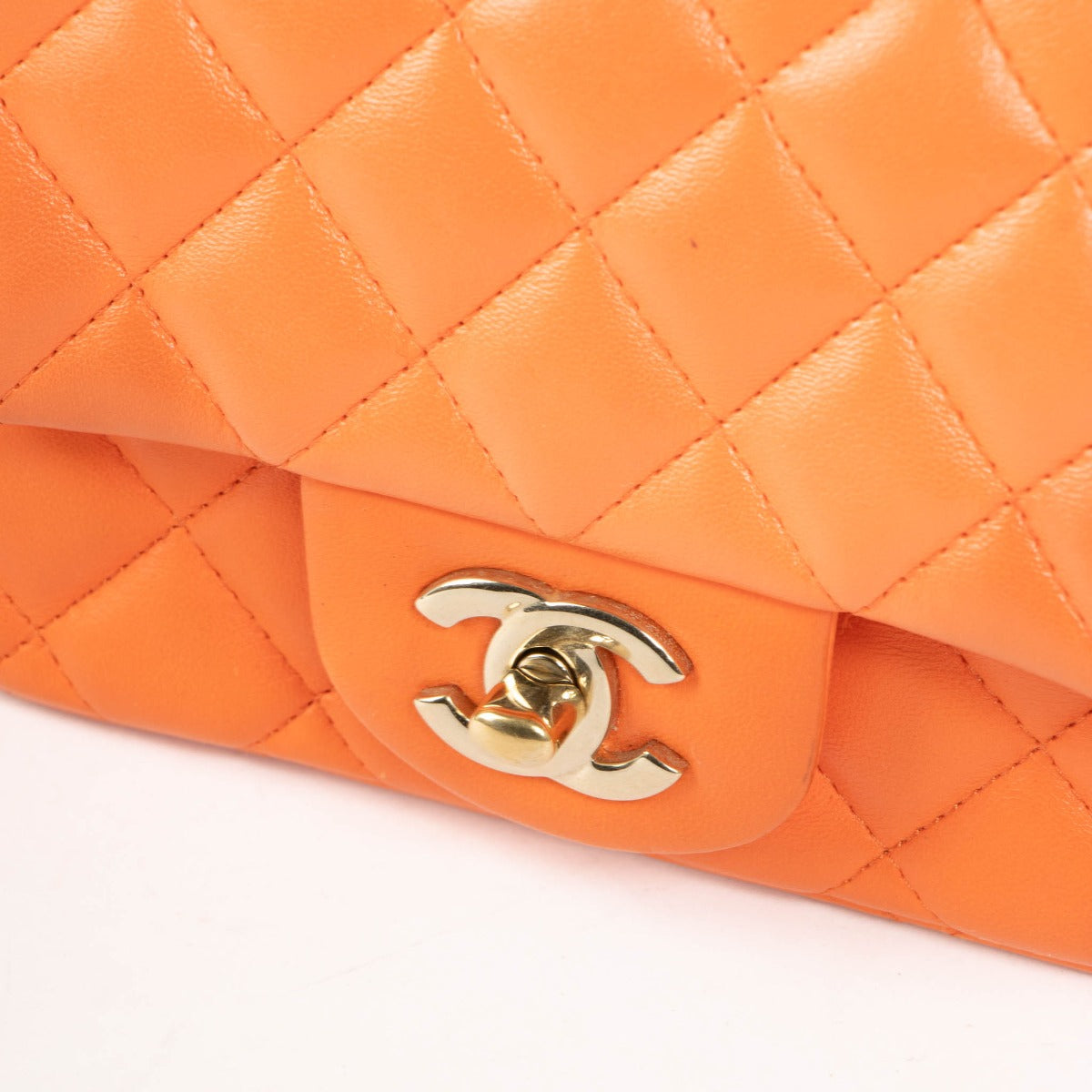 Shop this 100% authentic Chanel Orange Lambskin Mini Square Classic Bag at Labellov.com