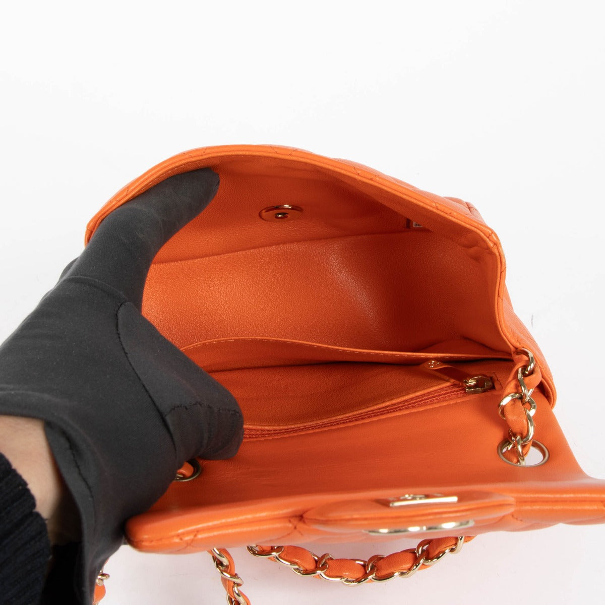 Shop this 100% authentic Chanel Orange Lambskin Mini Square Classic Bag at Labellov.com