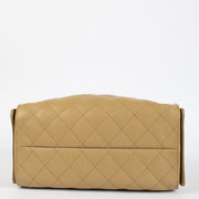 Chanel Classic Small Flap Bag 25 cm in beige caviar leather with gold hardware. A timeless Chanel icon in very good pre-loved condition.