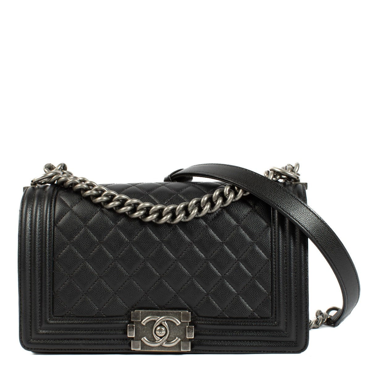 Chanel Boy Bag in black, featuring quilted leather, a signature push-lock closure, and a chunky chain strap. Shop now on Labellov.com.