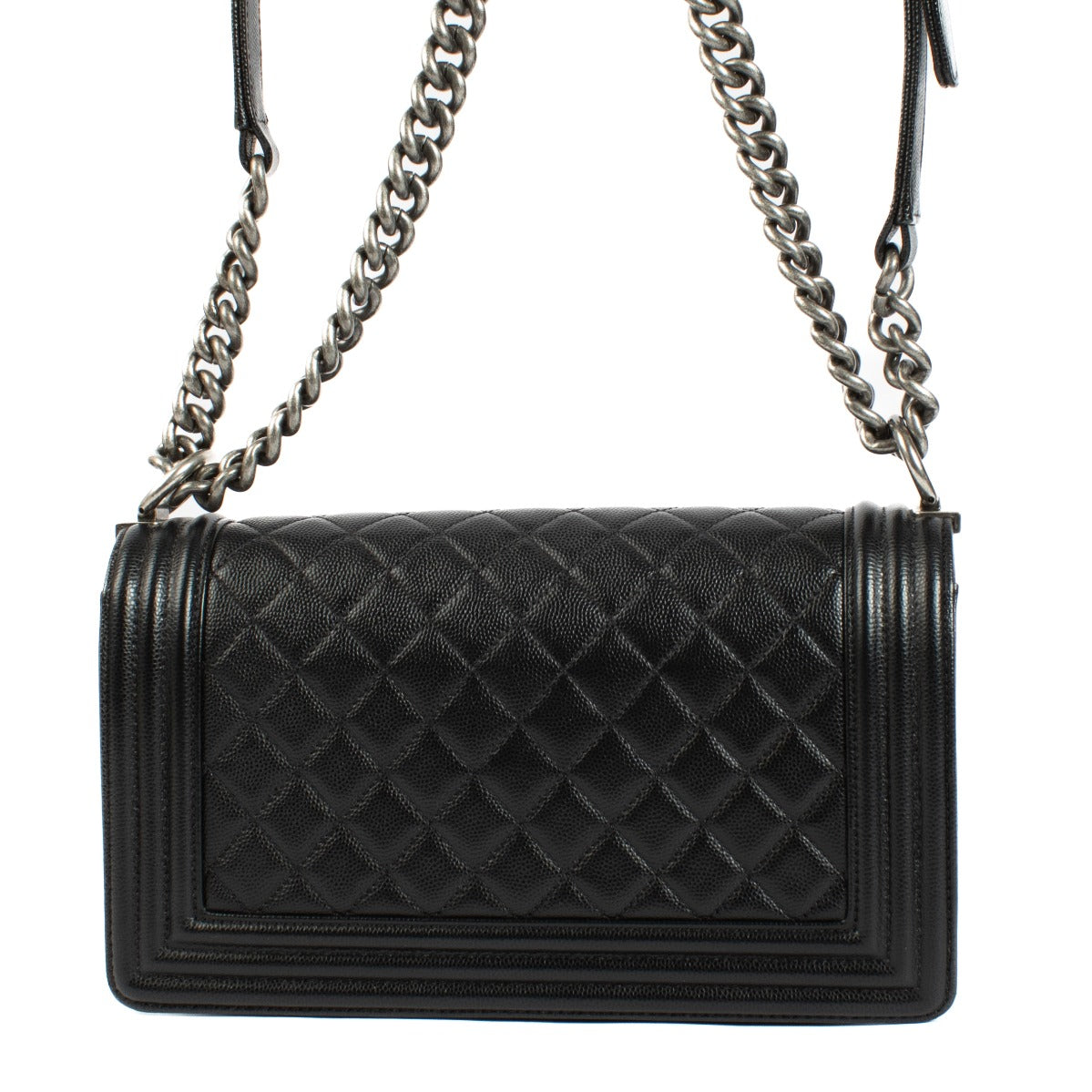 Chanel Boy Bag in black, featuring quilted leather, a signature push-lock closure, and a chunky chain strap. Shop now on Labellov.com.