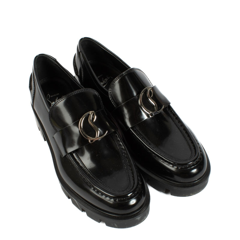 Christian Louboutin Black Loafers - Size 38, crafted from premium black leather with sleek lines and the iconic red sole, offering a stylish and luxurious design. Shop now on Labellov.com.