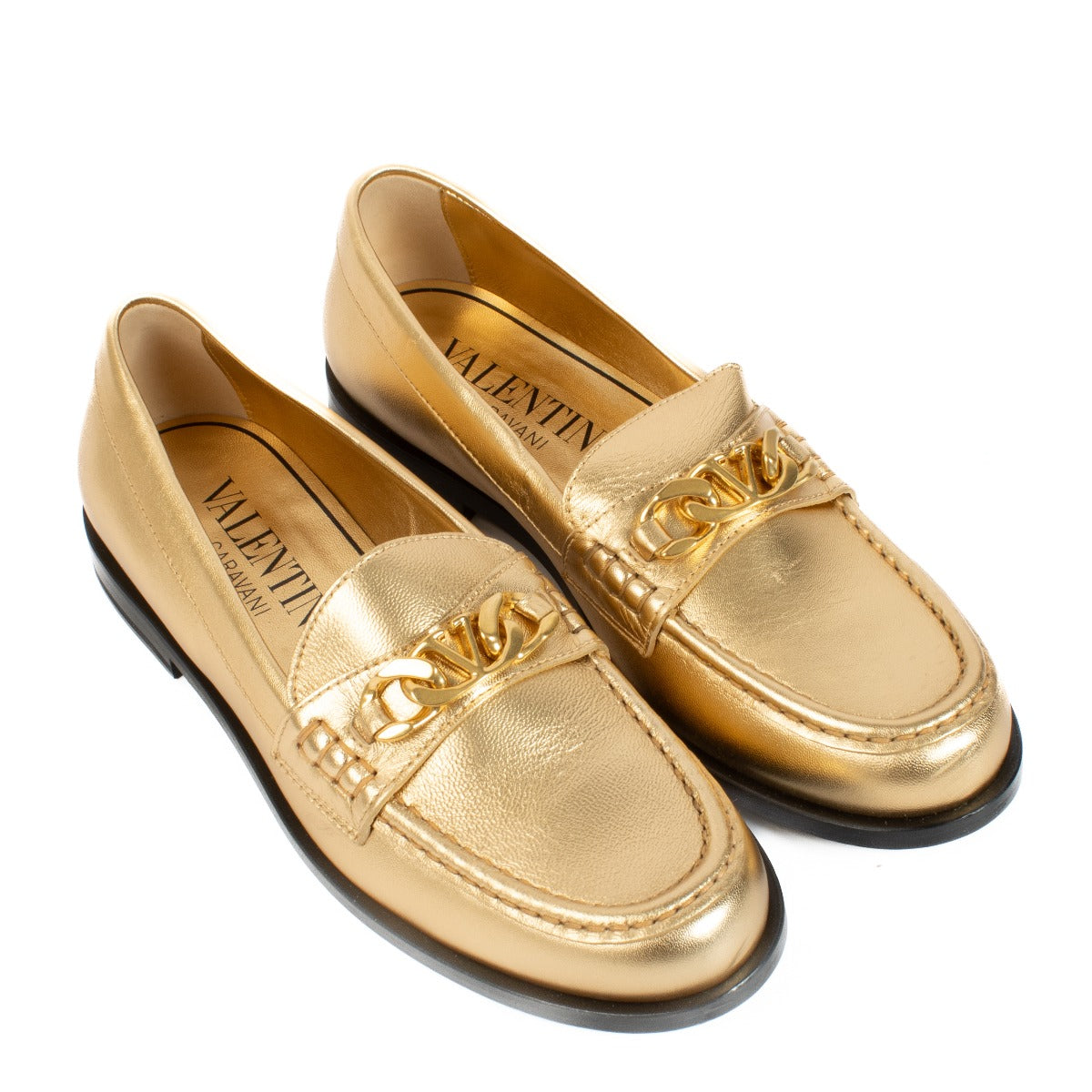 Valentino Garavani Gold Loafers in matte gold, size 38, featuring a sleek design with signature. Shop now on Labellov.com.