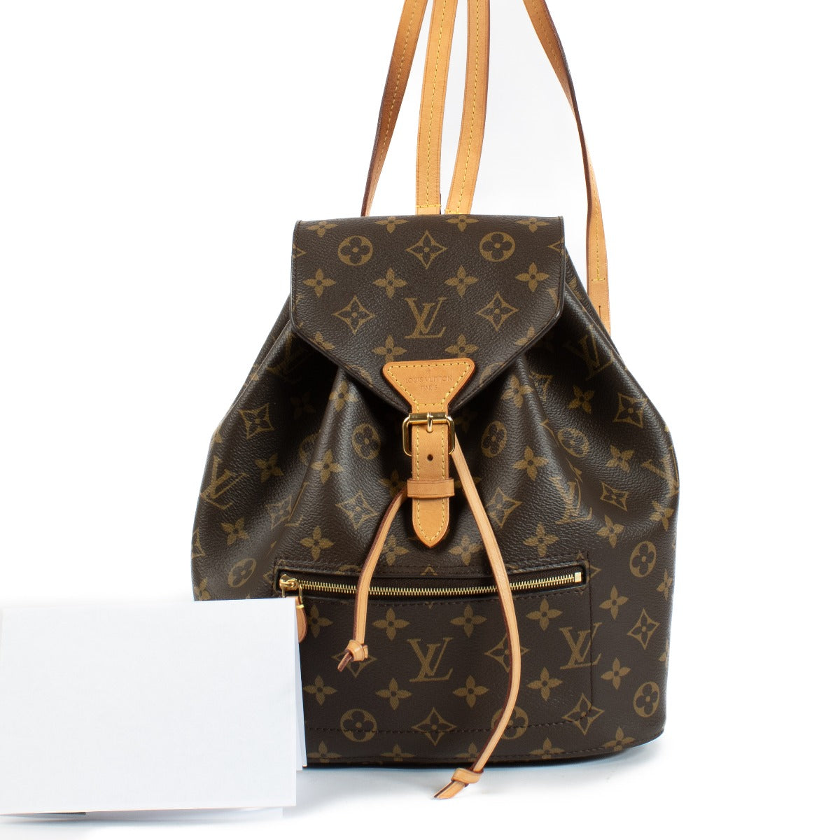 The Louis Vuitton Monogram Montsouris Backpack features the iconic LV monogram canvas with natural leather trim, a drawstring closure with a buckle flap, and adjustable leather straps for comfort. Its spacious interior and front zip pocket offer practical