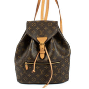 The Louis Vuitton Monogram Montsouris Backpack features the iconic LV monogram canvas with natural leather trim, a drawstring closure with a buckle flap, and adjustable leather straps for comfort. Its spacious interior and front zip pocket offer practical
