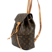 The Louis Vuitton Monogram Montsouris Backpack features the iconic LV monogram canvas with natural leather trim, a drawstring closure with a buckle flap, and adjustable leather straps for comfort. Its spacious interior and front zip pocket offer practical