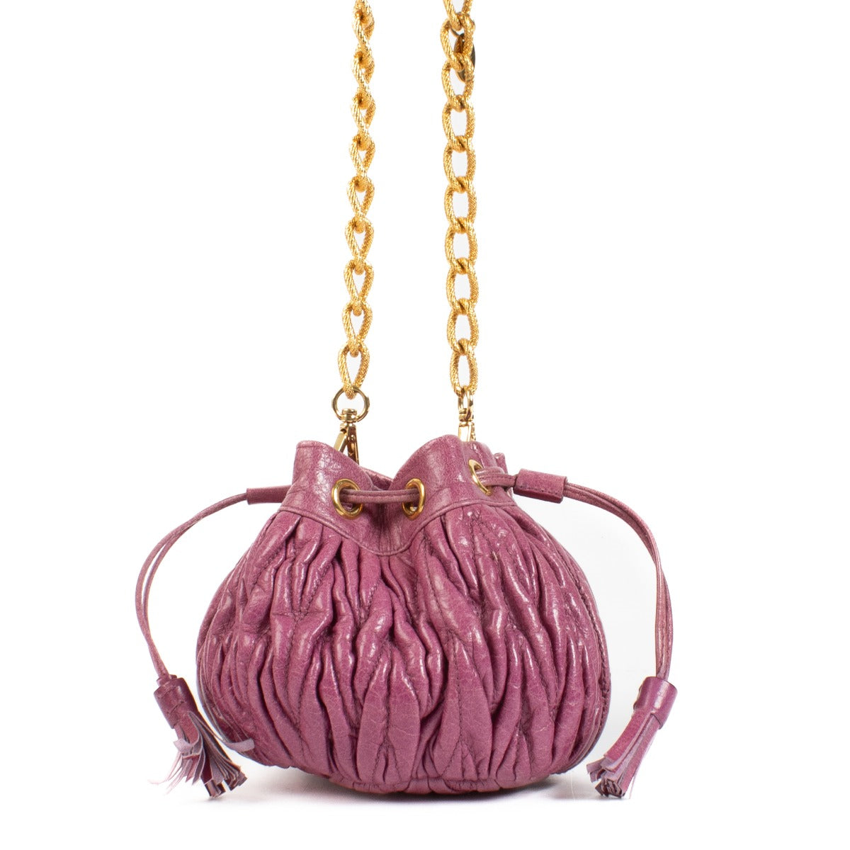 The Miu Miu Purple Crossbody is a small, pouch-shaped bag in a rich purple hue, featuring gold hardware for a luxurious touch. Perfect for carrying essentials in style. Buy now on Labellov.com
