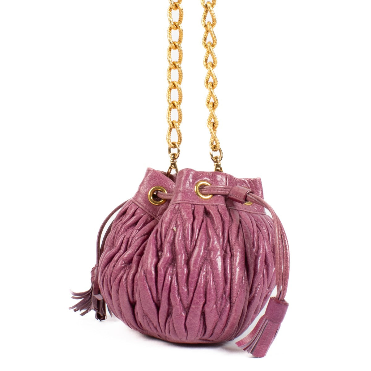 The Miu Miu Purple Crossbody is a small, pouch-shaped bag in a rich purple hue, featuring gold hardware for a luxurious touch. Perfect for carrying essentials in style. Buy now on Labellov.com