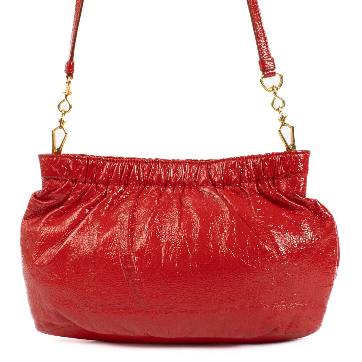 The Miu Miu Red Shoulder Bag in glossy red leather features gold hardware and the iconic Miu Miu logo on the front. Its pouch shape adds a modern, chic touch to the design. Shop now at Labellov.