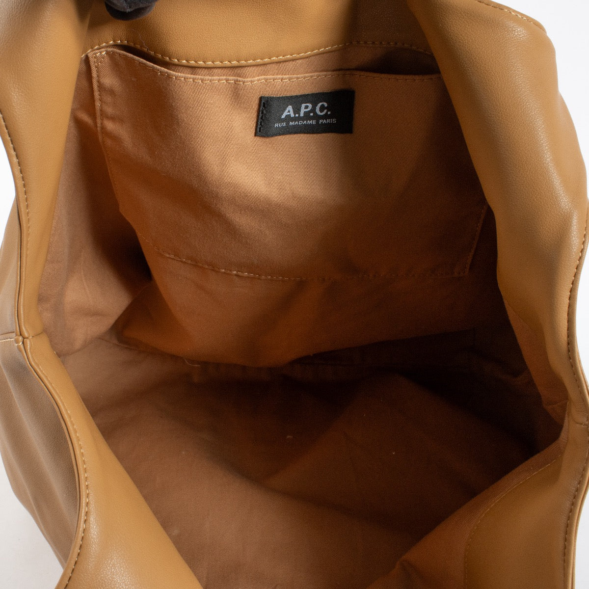 A.P.C. camel leather tote shoulder bag with logo print and soft structure at Labellov.com
