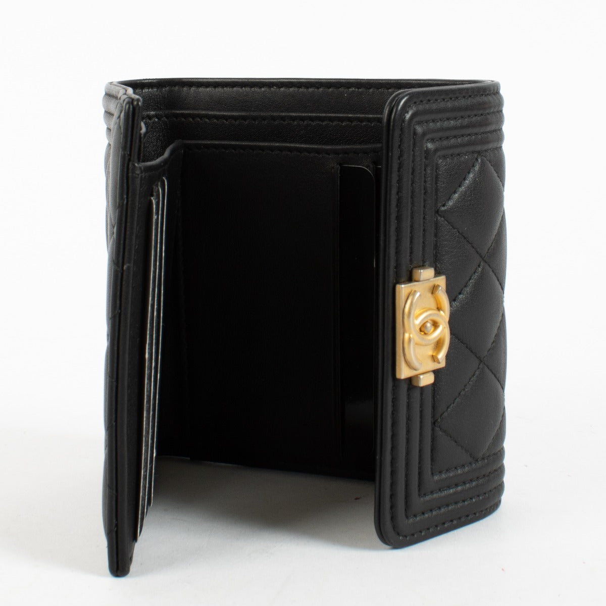 Chanel Black Boy Wallet in quilted leather with gold-tone CC clasp at Labellov.com