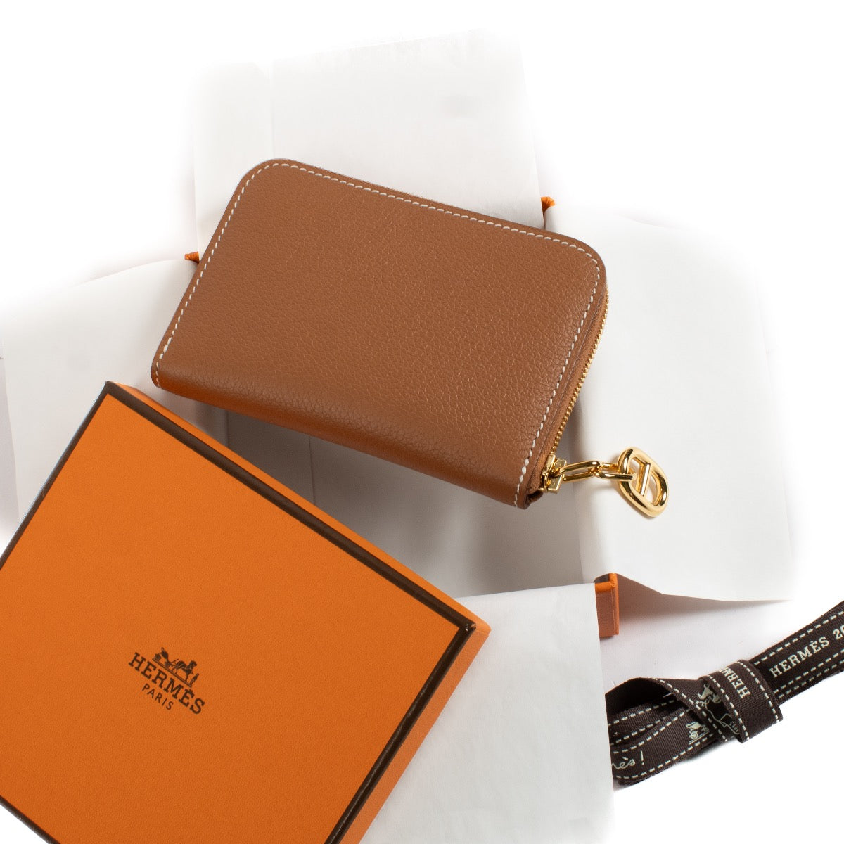 shop 100% authentic second hand Hermès Gold Zipengo Wallet on Labellov.com