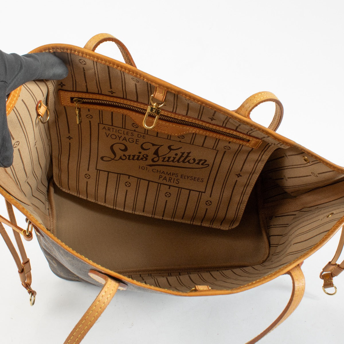 Louis Vuitton Monogram Neverfull tote bag in brown coated canvas with leather handles, pre-owned condition at Labellov.com