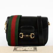The Gucci Horsebit 1955 Small Bag in black leather is a contemporary tribute to Gucci’s storied equestrian heritage, reimagined for the modern wardrobe.