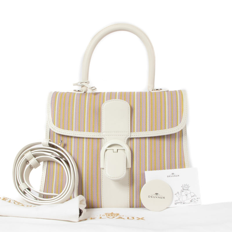 Shop safe online at Labellov in Antwerp, Brussels and Knokke this 100% authentic second hand Delvaux Rainbow Toile de Cuir/Ivory Calf Souple Brillant MM. Veilig online tweedehands authentieke Delvaux Rainbow Toile de Cuir/Ivory Calf Souple Brillant MM kop
