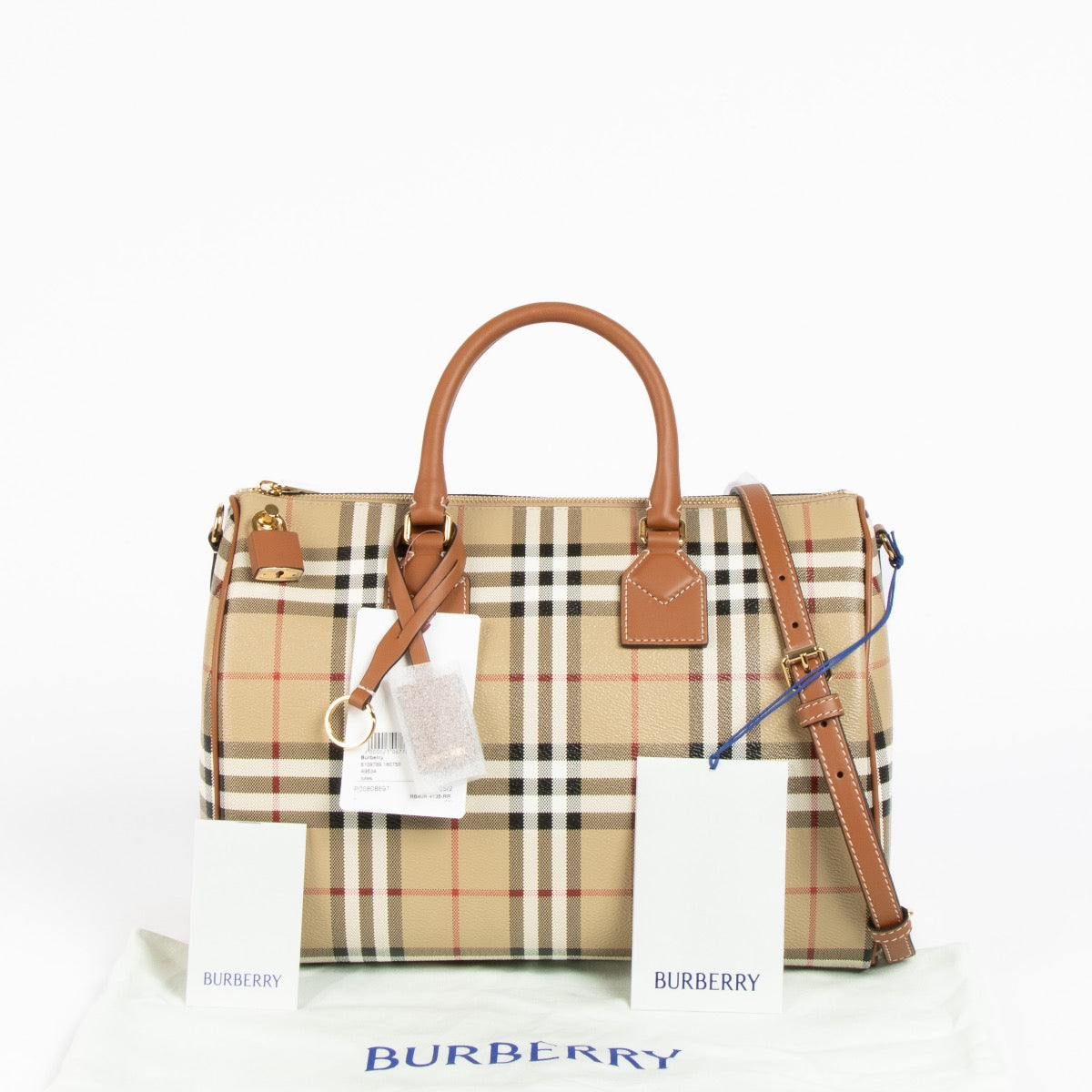 Authentic pre-loved Burberry Beige Canvas Medium Bowling Top Handle Bag on Labellov.com