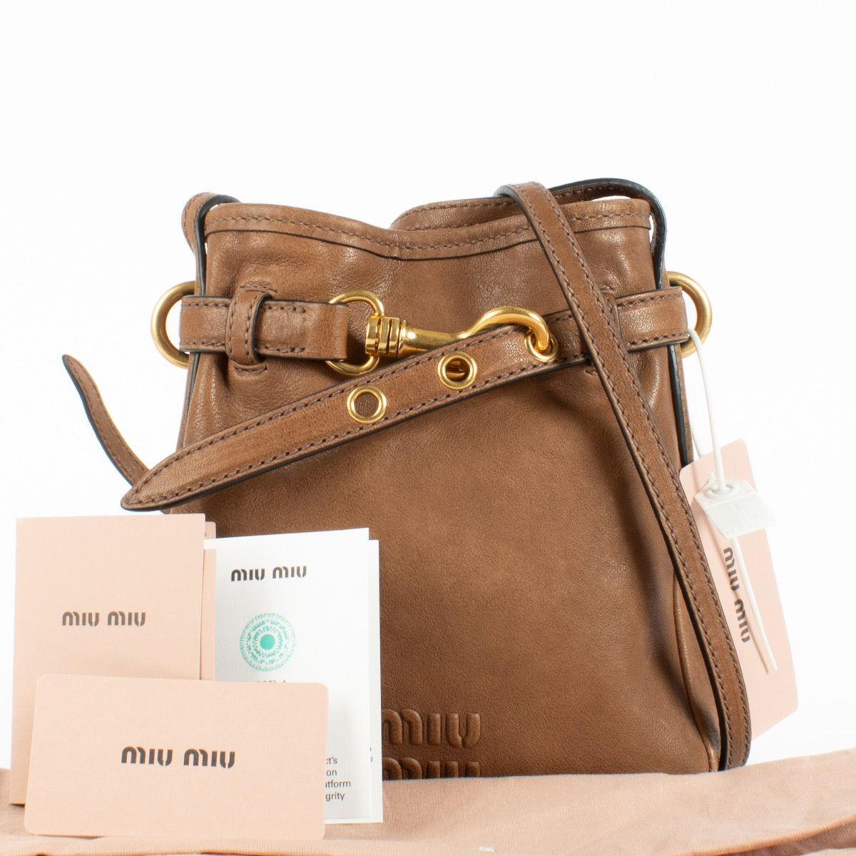Authentic Preloved Miu Miu Aventure Brown Pouch Bag Crossbody on Labellov.com