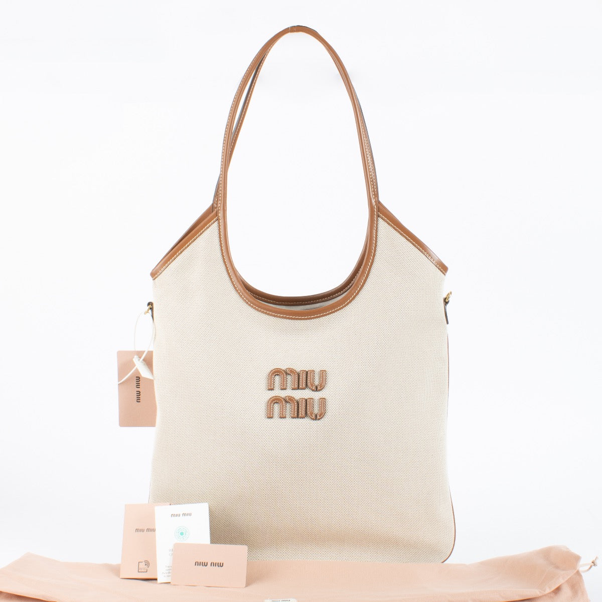 Authentic Preloved Miu Miu Beige Canvas Ivy Tote Bag on Labellov.com