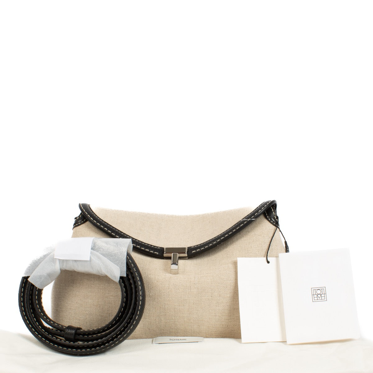 shop 100% authentic second hand Toteme T-Lock Canvas Clutch on Labellov.com