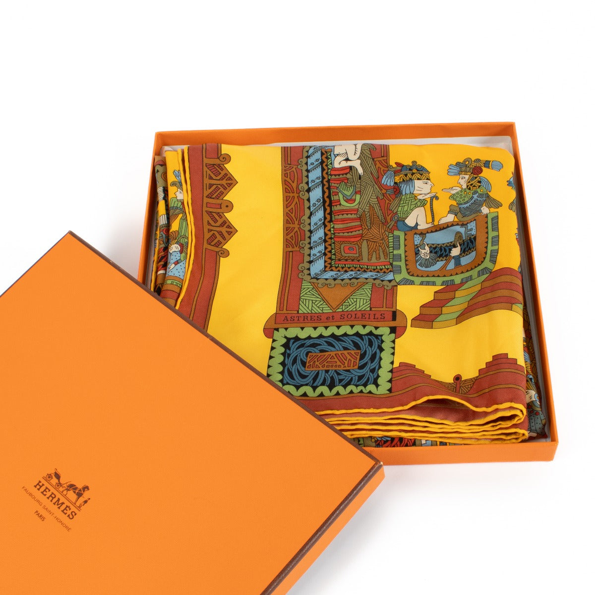 Vibrant Hermès multicolor 90 silk scarf featuring bold yellow, red, blue, and green hues with the brand's iconic patterns. Buy now on Labellov.