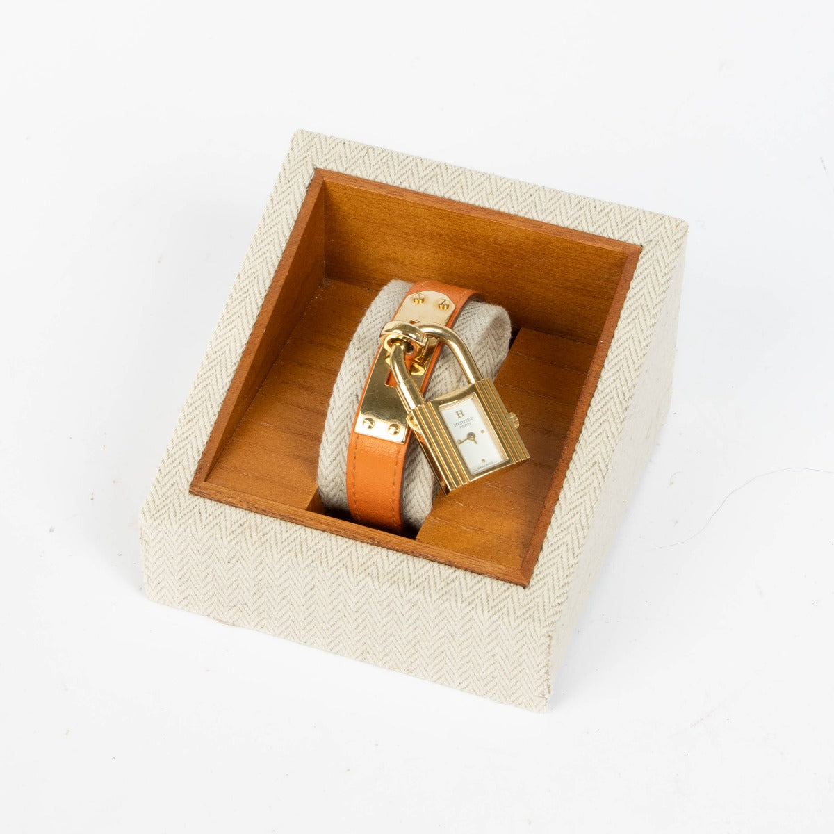 Shop this 100% authentic Hermès Gold Kelly Watch with orange strap at Labellov.com
