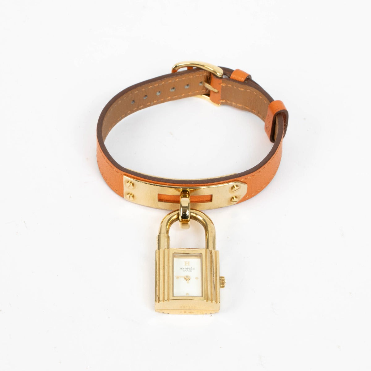 Shop this 100% authentic Hermès Gold Kelly Watch with orange strap at Labellov.com
