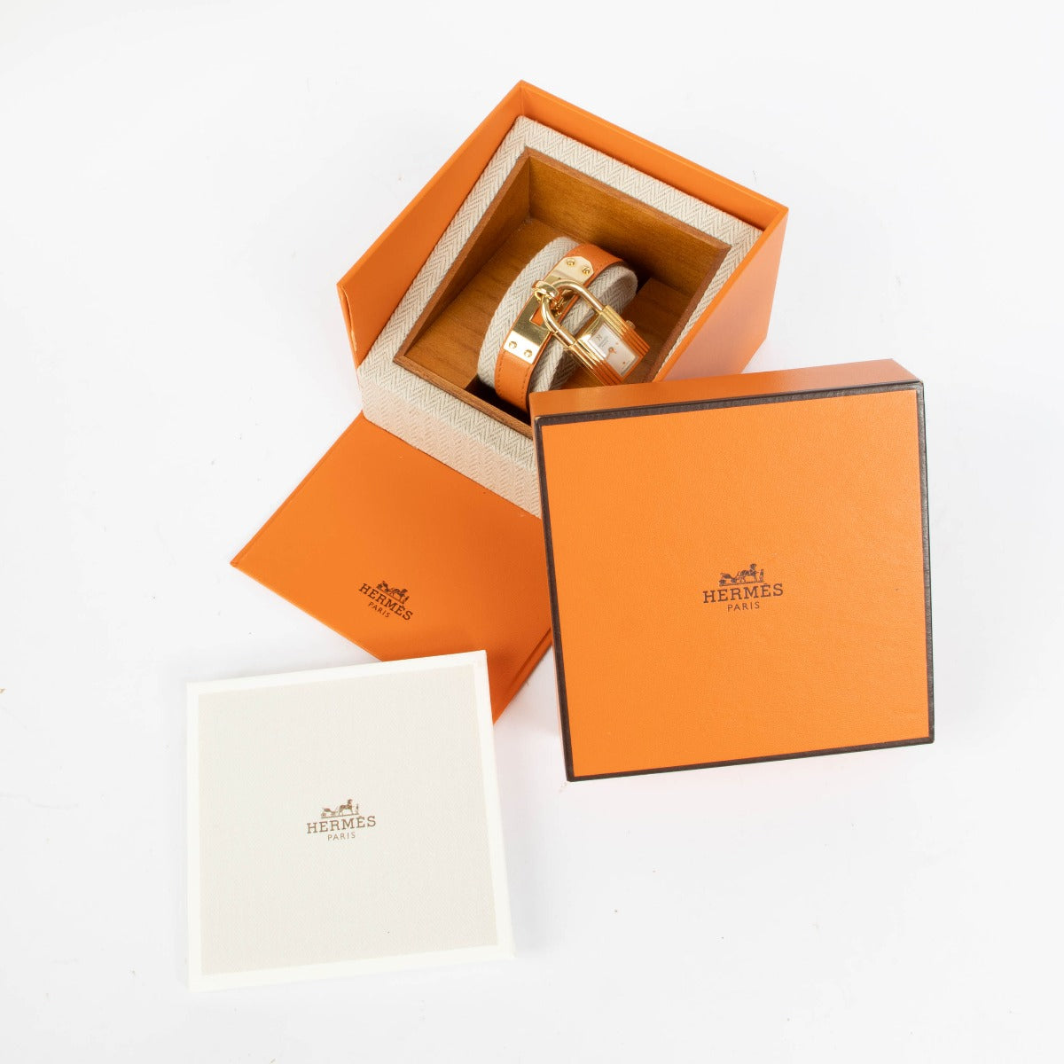 Shop this 100% authentic Hermès Gold Kelly Watch with orange strap at Labellov.com
