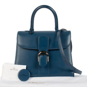 Shop safe online at Labellov in Antwerp, Brussels and Knokke this 100% authentic second hand Delvaux Bleu de Prusse Box Calf Brillant MM + Strap. Veilig online authentieke tweedehands Delvaux Brillant MM kopen bij Labellov.