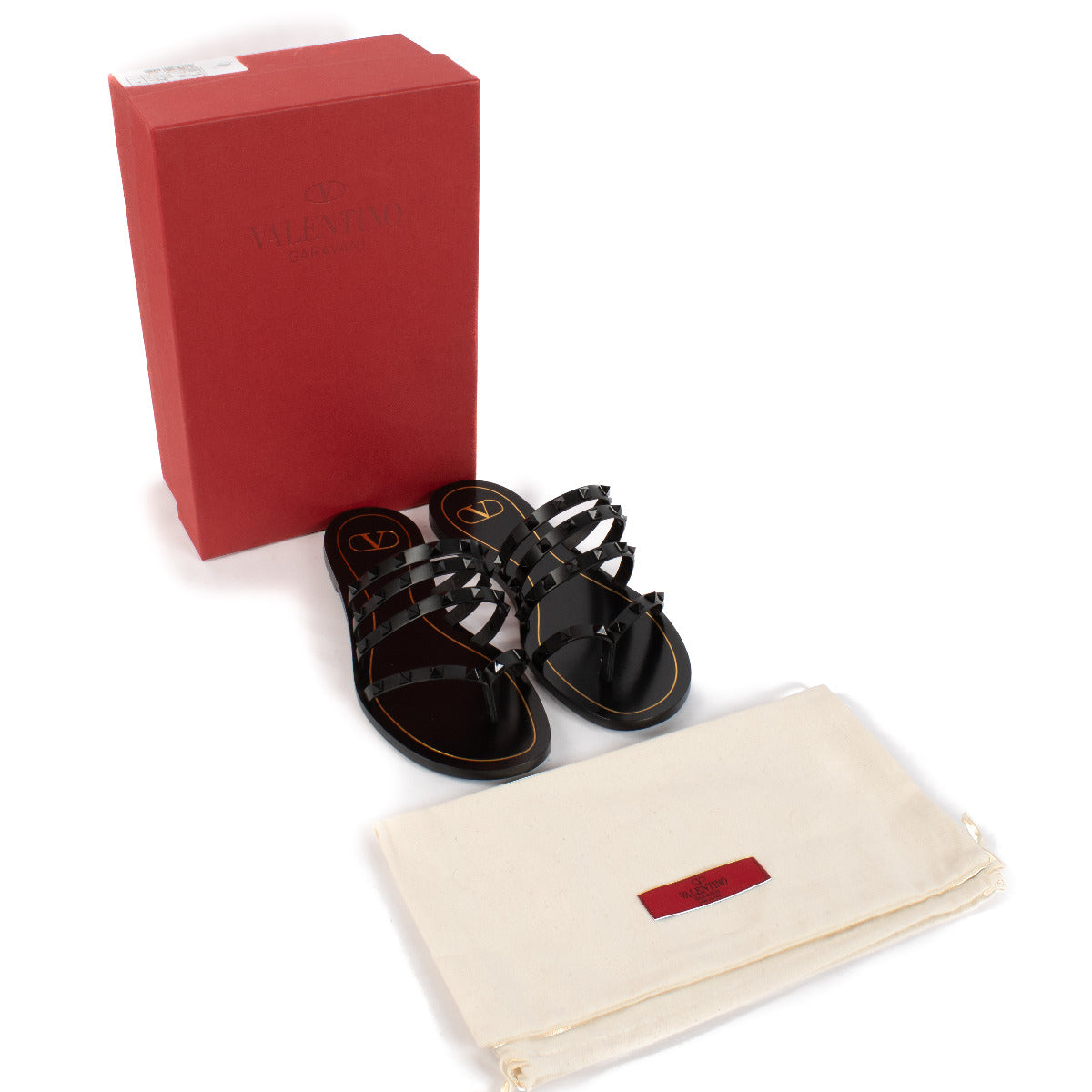 The Valentino Garavani All-Black Rockstud Flat Sandals in size 41 offer a perfect blend of effortless sophistication and modern edge. Crafted from premium Italian leather, these sandals showcase Valentino's signature Rockstud detailing, each black stud me