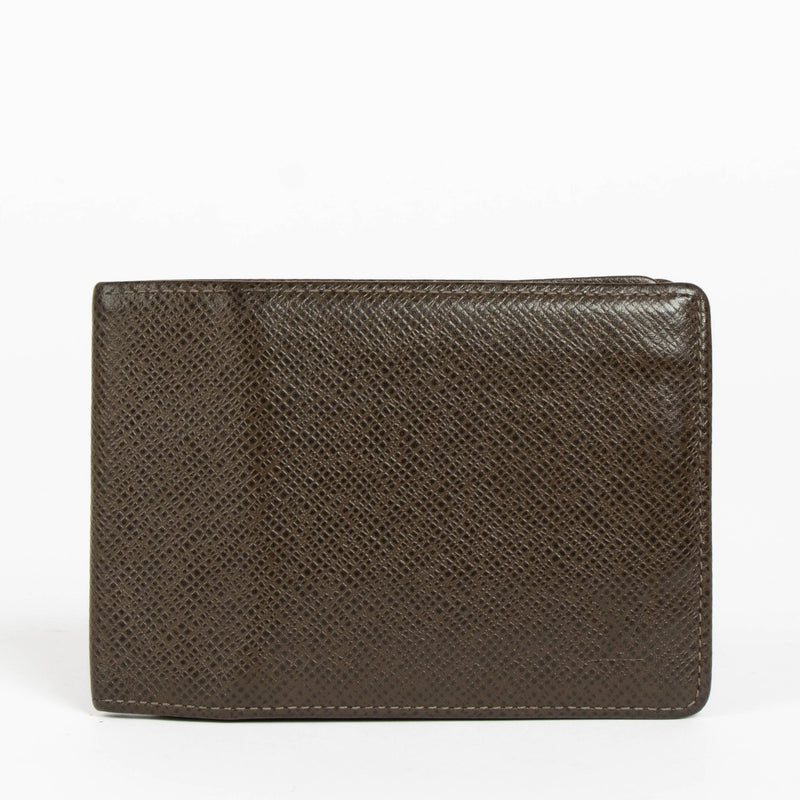 Authentic pre-loved Louis Vuitton Taiga Leather Bifold Wallet on Labellov.com