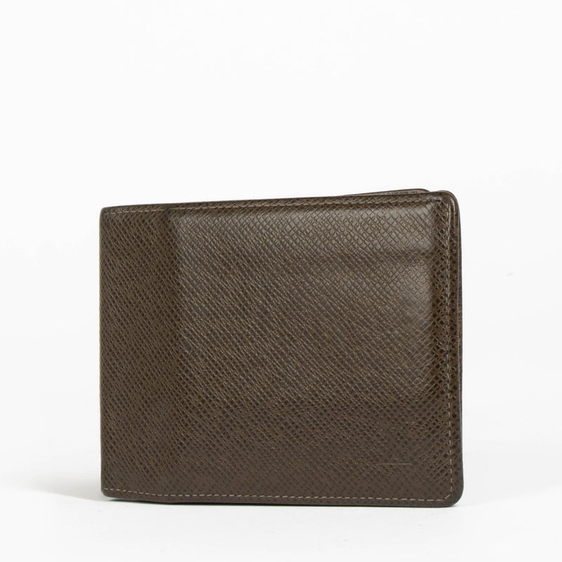 Authentic pre-loved Louis Vuitton Taiga Leather Bifold Wallet on Labellov.com