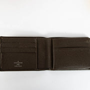 Authentic pre-loved Louis Vuitton Taiga Leather Bifold Wallet on Labellov.com